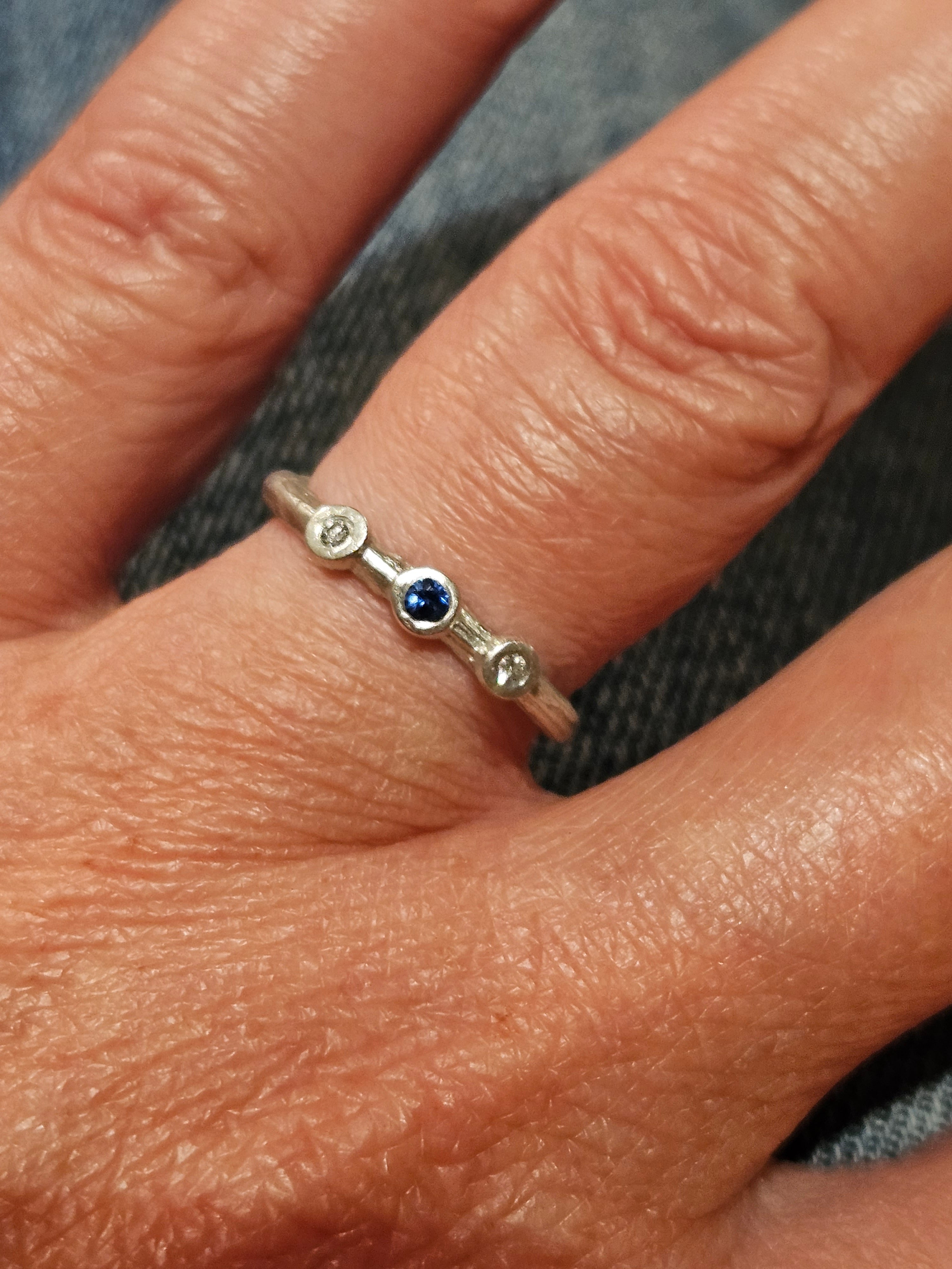 3 stone, 2 diamonds and blue Sapphire twig ring