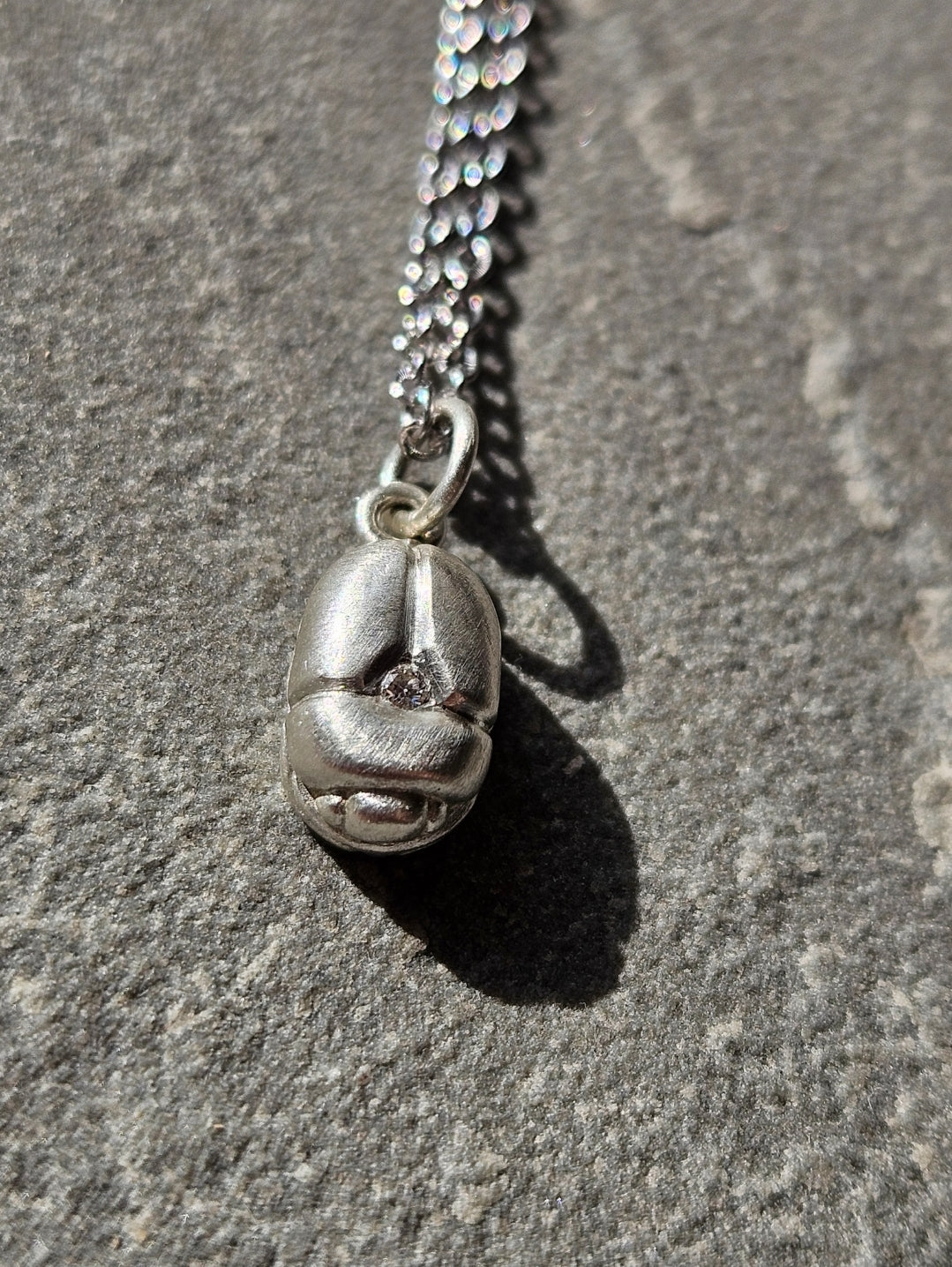 Scarab charm with Diamond in Sterling Silver.